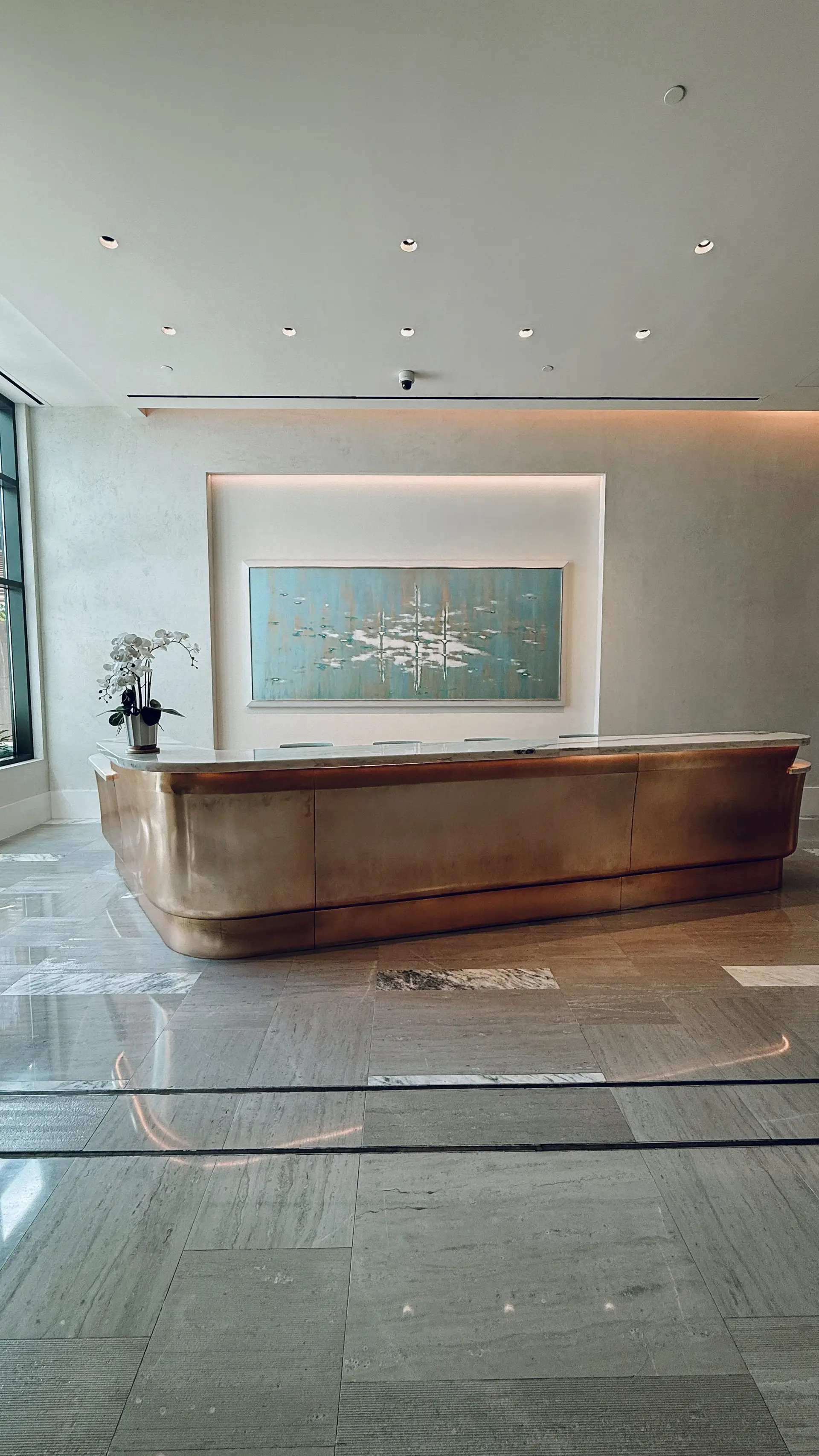 Modern hotel lobby design with golden accents